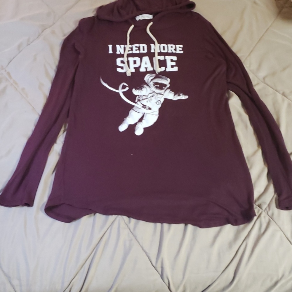 A maroon long sleeve shirt